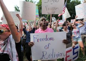 Some 500 people gathered for a hastily organized counter-protest against the attack on Muslims