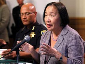 Oakland Mayor Jean Quan (speaking), while Police Chief Howard Jordan