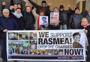 Demonstrators stand in support of Rasmea Odeh
